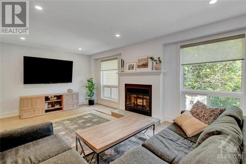 19'8" x 12'4" - 82 Gladecrest Court, Ottawa, ON - Indoor Photo Showing Living Room With Fireplace
