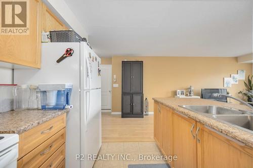 6 - 145 Isaac Devins Boulevard, Toronto, ON - Indoor Photo Showing Kitchen With Double Sink