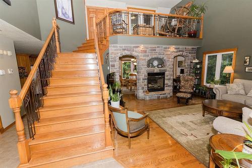 85 Heritage Drive, Dufferin, MB - Indoor Photo Showing Other Room With Fireplace