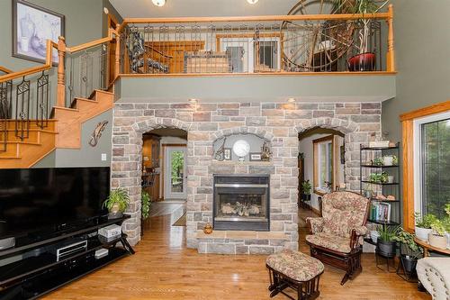 85 Heritage Drive, Dufferin, MB - Indoor Photo Showing Living Room With Fireplace