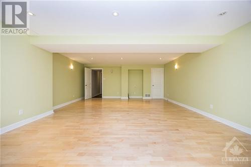 Fully finished with wood flooring and high cielings. - 141 Manorhill Private, Ottawa, ON - Indoor Photo Showing Other Room