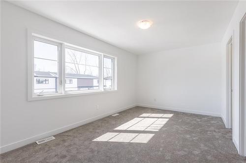 Primary Bedroom with ensuite and walk-in closet - 4263 Fourth Avenue|Unit #821, Niagara Falls, ON - Indoor Photo Showing Other Room