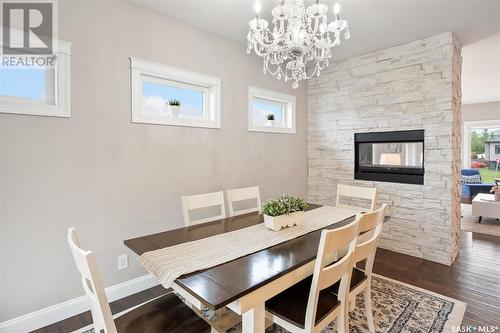 923 Sauer Crescent, Saskatoon, SK - Indoor Photo Showing Dining Room With Fireplace