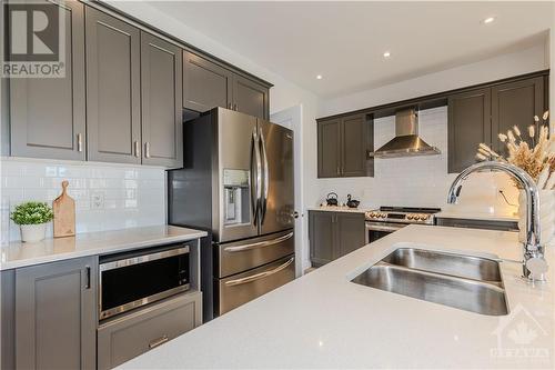 Gourmet kitchen with upgraded cabinetries, quartz counters, and S/S appliances - 600 Triangle Street, Ottawa, ON - Indoor Photo Showing Kitchen With Double Sink With Upgraded Kitchen