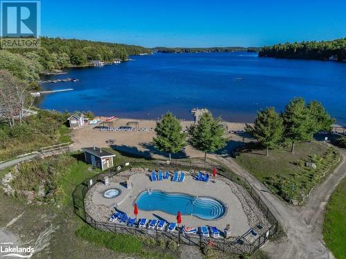 Aerial of beach pool - 1869 Muskoka Road 118 Highway W Unit# A202-D1, Muskoka Lakes, ON - Outdoor With Body Of Water With In Ground Pool With View