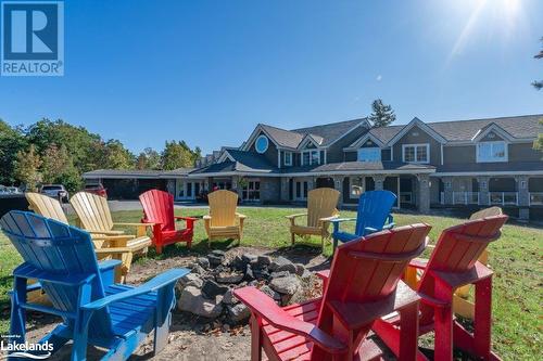 Fire pit at Reception - 1869 Muskoka Road 118 Highway W Unit# A202-D1, Muskoka Lakes, ON - Outdoor With Deck Patio Veranda