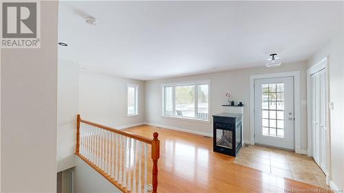 32 Chateau Drive, Mcleod Hill, NB - Indoor Photo Showing Other Room With Fireplace