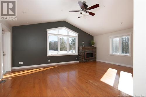 32 Chateau Drive, Mcleod Hill, NB - Indoor Photo Showing Living Room With Fireplace