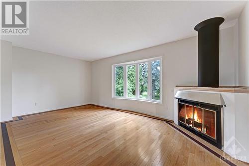 6339 Long Bow Gate, Ottawa, ON - Indoor With Fireplace