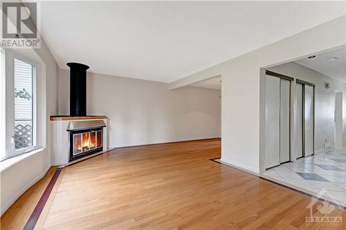 6339 Long Bow Gate, Ottawa, ON - Indoor With Fireplace