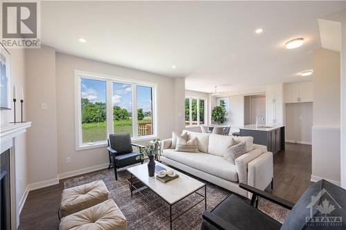 1007 Canoe Street, Barrhaven, ON - Indoor Photo Showing Living Room With Fireplace