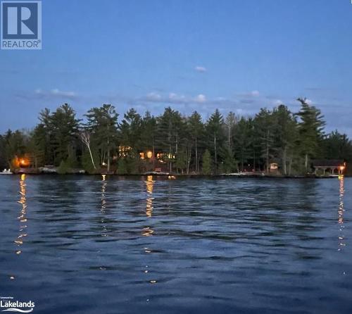 Shows the lights across the whole front of the property - 620 Island 180, Port Severn, ON - Outdoor With Body Of Water With View