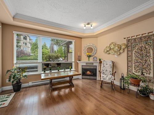 311-3666 Royal Vista Way, Courtenay, BC - Indoor Photo Showing Living Room With Fireplace