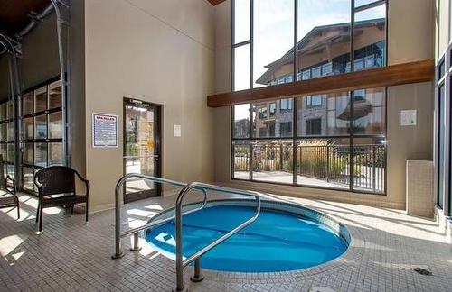 211-4380 Lakeshore Road, Kelowna, BC - Indoor Photo Showing Other Room With In Ground Pool