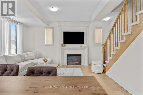 52 - 383 Dundas Street E, Hamilton, ON - Indoor Photo Showing Living Room With Fireplace