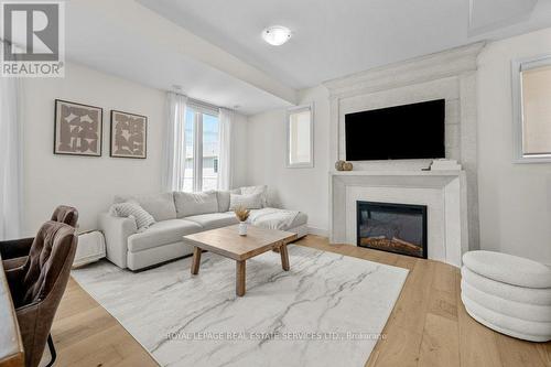 52 - 383 Dundas Street E, Hamilton, ON - Indoor Photo Showing Living Room With Fireplace