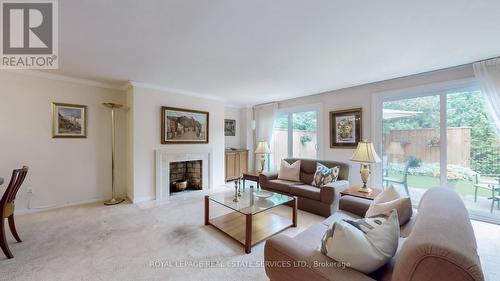 61 James Foxway, Toronto, ON - Indoor Photo Showing Living Room With Fireplace