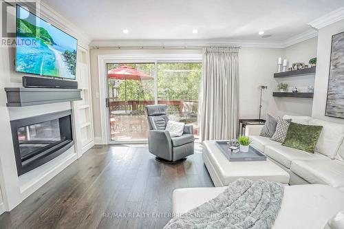 44 - 1060 Walden Circle, Mississauga, ON - Indoor Photo Showing Living Room With Fireplace