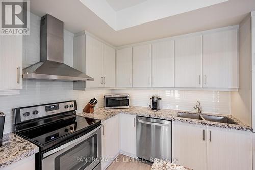 1 - 125 Long Branch Avenue, Toronto, ON - Indoor Photo Showing Kitchen With Stainless Steel Kitchen With Double Sink With Upgraded Kitchen