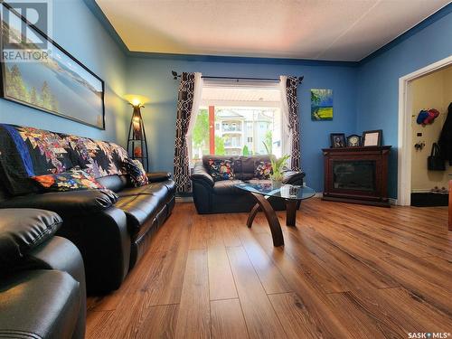 136 5Th Street Ne, Weyburn, SK - Indoor Photo Showing Living Room With Fireplace