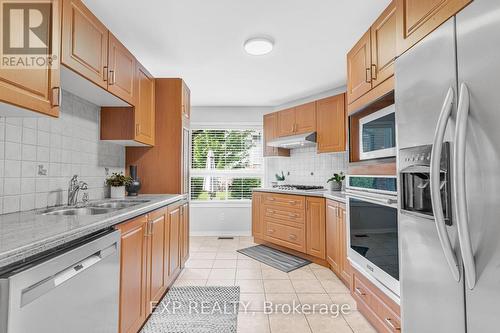 64 - 2550 Thomas Street, Mississauga, ON - Indoor Photo Showing Kitchen With Double Sink