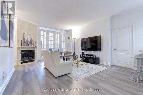 104 - 1 Ripley Avenue, Toronto, ON - Indoor Photo Showing Living Room With Fireplace