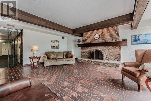906 - 225 Harvard Place, Waterloo, ON - Indoor Photo Showing Living Room With Fireplace
