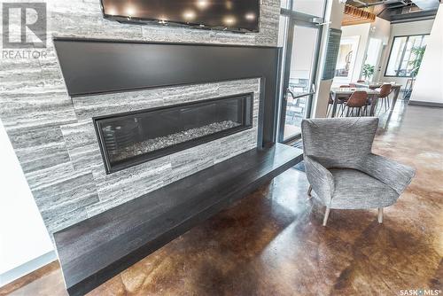 508A 3359 Green Poppy Street, Regina, SK - Indoor Photo Showing Living Room With Fireplace