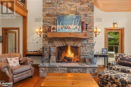 1622 West Shore Rd, Dysart, ON - Indoor Photo Showing Living Room With Fireplace