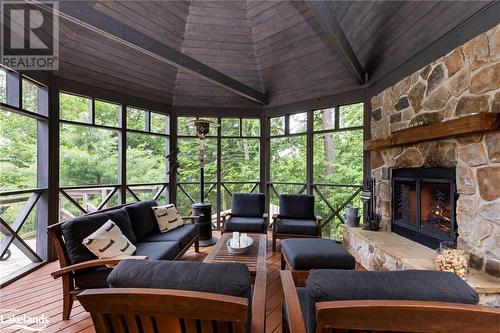 1622 West Shore Rd, Dysart, ON - Indoor Photo Showing Living Room With Fireplace