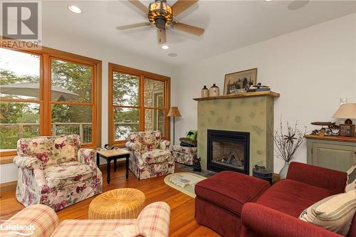 1622 West Shore Rd, Dysart, ON - Indoor Photo Showing Living Room With Fireplace