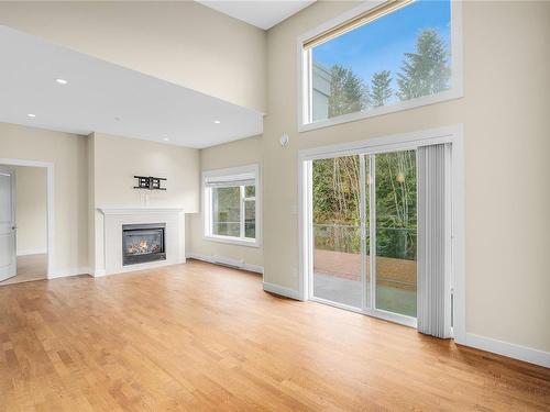 404-1838 Cowichan Bay Rd, Cowichan Bay, BC - Indoor Photo Showing Living Room With Fireplace