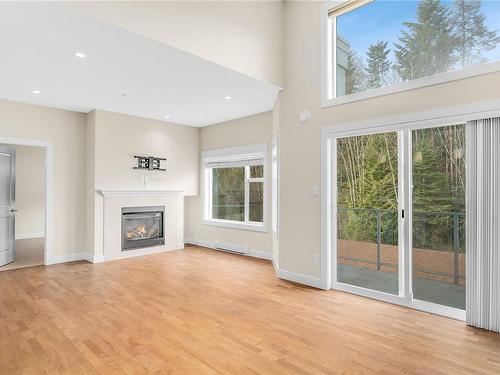 404-1838 Cowichan Bay Rd, Cowichan Bay, BC - Indoor Photo Showing Living Room With Fireplace