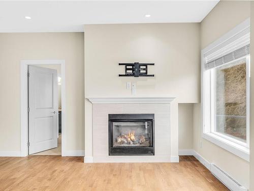 404-1838 Cowichan Bay Rd, Cowichan Bay, BC - Indoor Photo Showing Living Room With Fireplace