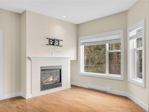 404-1838 Cowichan Bay Rd, Cowichan Bay, BC - Indoor Photo Showing Living Room With Fireplace