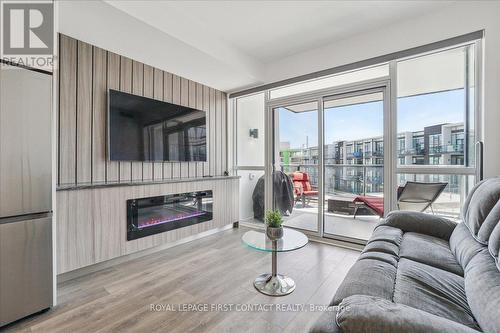 302 - 415 Sea Ray Avenue, Innisfil, ON - Indoor Photo Showing Living Room With Fireplace