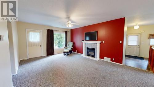 13084 Firehall Road, Charlie Lake, BC - Indoor With Fireplace