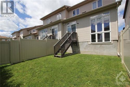 Fully fenced backyard, secured with maintenance-free PVC fencing (installed in 2024). - 210 Rolling Meadow Crescent, Ottawa, ON 