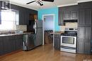 724 3Rd Street E, Shaunavon, SK  - Indoor Photo Showing Kitchen With Double Sink 