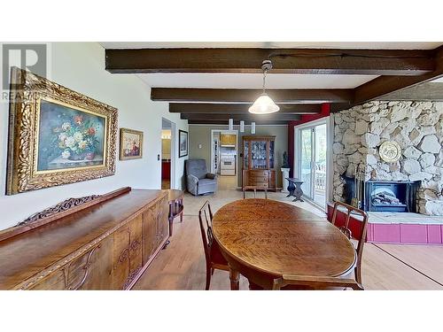 6217 97Th Street, Osoyoos, BC - Indoor Photo Showing Dining Room With Fireplace