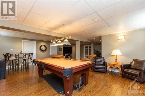 The fully finished lower level provides an additional bedroom, craft room, full bathroom, ample storage, and expansive room for recreational activities with family and friends - 1854 Springridge Drive, Ottawa, ON - Indoor Photo Showing Other Room