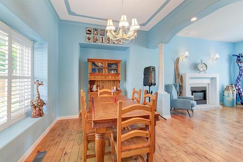 5168 Morrison Crescent, Peachland, BC - Indoor Photo Showing Dining Room With Fireplace