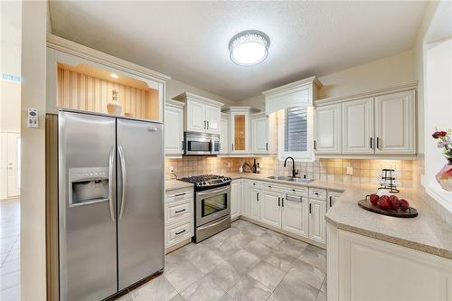 Virtually Staged - 1779 Healy Road, London, ON - Indoor Photo Showing Kitchen With Double Sink