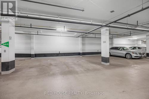 414 - 128 Fairview Mall Drive, Toronto, ON - Indoor Photo Showing Garage