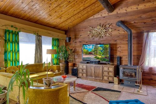 1902 Highway 97, Okanagan Falls, BC - Indoor Photo Showing Living Room With Fireplace