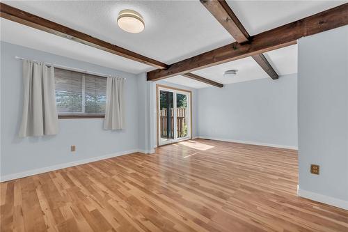 Family room with double doors to Backyard - 65 Canterbury Drive, St. Catharines, ON - Indoor Photo Showing Other Room