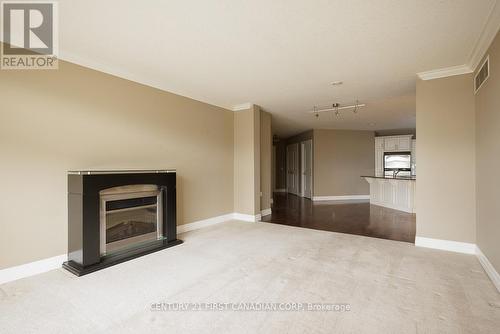 707 - 250 Pall Mall Street, London, ON - Indoor Photo Showing Living Room With Fireplace
