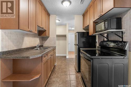 206 710 Melrose Avenue, Saskatoon, SK - Indoor Photo Showing Kitchen With Double Sink