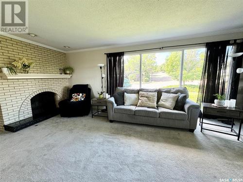 10008 5Th Avenue, North Battleford, SK - Indoor Photo Showing Living Room With Fireplace