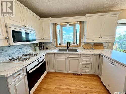 10008 5Th Avenue, North Battleford, SK - Indoor Photo Showing Kitchen With Double Sink